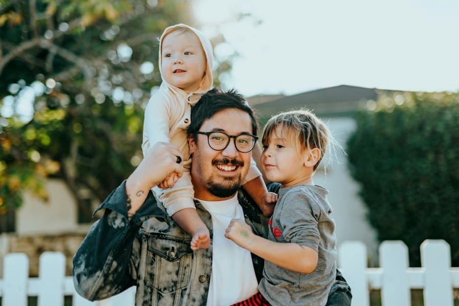 Father with his two children outside their home